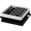 A black notebook and pen set in a sleek black and white gift box. The set features a logo on the notebook.