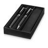A stylish gift set featuring two metal ballpoint pens with a sleek black design, presented in a black box.