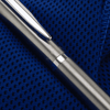 A metallic ballpoint pen with a sleek design, featuring a silver clip and detailing, on a textured blue surface.