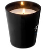 A black scented candle in a sleek container, featuring a glowing flame and a subtle logo.