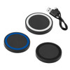 A set of three wireless charging pads in black, with one featuring a blue rim, accompanied by a USB cable.