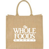A large jute tote bag in natural colour with sturdy handles and a logo on the front.