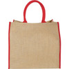 A large jute tote bag in natural jute with red handles and trim, featuring a logo.