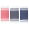 A set of three Trekk Turkish beach towels in red, navy, and dark navy with striped designs and tasselled edges.