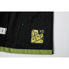 A softshell jacket in black with a lime green lining, featuring a logo on the inner side.