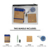 A clear zip pouch containing a blue paper jotter pad, a memo note pad, hand sanitiser, and correction tape.