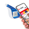 A blue correction tape dispenser next to a smartphone displaying a webpage. The dispenser includes a logo.