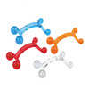 A set of four massagers in blue, red, orange, and clear colours, each shaped like a small dumbbell.