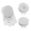 A round white fridge magnet clip featuring an open view, back view, and a note attached. It has a logo on it.