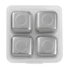 A set of four stainless steel whiskey ice cubes in a clear case. Each cube has a circular design on top.