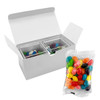 A gift pack containing two clear cubes of colourful jelly beans and a separate packet of assorted jelly beans.
