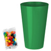 A bright green party cup next to a bag of colourful jelly beans in various shades. The bag is transparent.