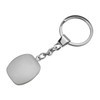 A metallic key ring with a smooth, white cubic pendant attached by a chain.