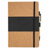 A cork notebook with a black elastic band and a matching black pen attached. Includes branding on the cover.