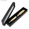 A wooden pen with a gold clip nestled in a sleek black box, featuring an inner elastic strap.