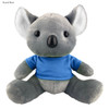 A grey koala plush toy wearing a blue shirt, featuring soft ears and a cute face, with a branding logo visible.