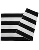 A striped beach towel in black and white with a logo, featuring alternating bold stripes.