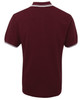A burgundy polo shirt with contrasting white details and short sleeves. It has a logo on the chest.