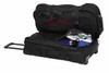 A black wheeled travel bag with multiple compartments, featuring sports shoes, a drink bottle, and clothing inside.