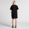 A black oversized dress with short sleeves, shown from the back, featuring a casual fit and a simple design.
