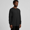 A long-sleeved black T-shirt on a model, featuring a simple design and a subtle logo.