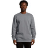 A grey hoodie is displayed on a male model, featuring a classic crew neck and long sleeves, with a logo present.