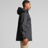 A black windbreaker jacket with a hood, featuring a side view of a person wearing it. The jacket has a logo.