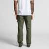 Utility pants in olive green, featuring multiple pockets. The model stands with their back towards the camera.
