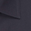 A close-up of a dark navy button-up shirt, showcasing the collar and stitching detail. It includes a subtle logo.