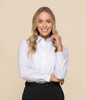 A button-up shirt in white, featuring a classic collar and a logo, modelled by a woman with long blonde hair.