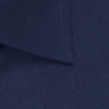 A close-up of a navy blue button-up shirt featuring a collar and stitching details. The shirt has a logo.