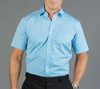 A light blue button-up shirt featuring a gingham pattern, with short sleeves and a collar. It has a discreet logo.