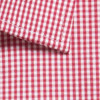 A red and white gingham button-up shirt featuring a folded collar and check pattern. The fabric has a smooth texture and a logo.