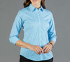 A button-up shirt in light blue gingham with long sleeves and a fitted design. The shirt has a logo on it.