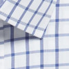 A button-up shirt featuring a blue and white checked pattern with a neat collar. It has a logo on the fabric.