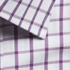 A button-up shirt featuring a white fabric with a purple check pattern and a folded collar.