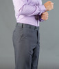 Grey slacks with a tailored fit, featuring side pockets and a sleek design, complemented by a purple checked shirt.