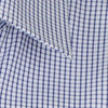 A close-up of a button-up shirt featuring a blue and white checkered pattern with a collar. It has a logo.