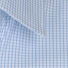 A button-up shirt featuring a blue and white checked pattern with a folded collar. It has a logo on the fabric.
