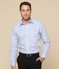 A button-up shirt in light blue with a subtle check pattern. Features a classic collar and long sleeves.