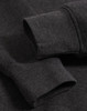 A close-up of the cuffs of a dark grey polar fleece jumper featuring a logo.