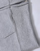 A grey fleecy hoodie featuring a full zip and ribbed cuff detail. It includes pockets and has a logo.