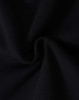 A close-up of black fleecy fabric, showcasing the soft texture and swirl pattern.