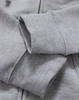 A close-up of a grey ladies' full-zip fleecy hoodie, featuring soft fabric and ribbed cuffs.