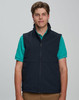 A men's softshell hi-tech vest in navy blue, featuring a zip front and side pockets, worn over a black t-shirt.