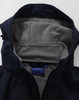 A navy softshell full zip hoodie with a grey fleece-lined interior and hood. Features a small logo inside.