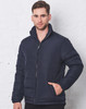 A navy heavy quilted puffer jacket with a zippered front and high collar, modelled by a man against a white wall.