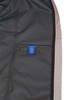 A men's waterproof performance jacket in grey with a mesh lining and a visible interior label.