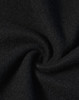 A close-up of black jacquard fleece fabric, showcasing its soft and textured surface.