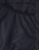 A close-up of the interior lining of a black sustainable parka jacket featuring a mesh texture.
